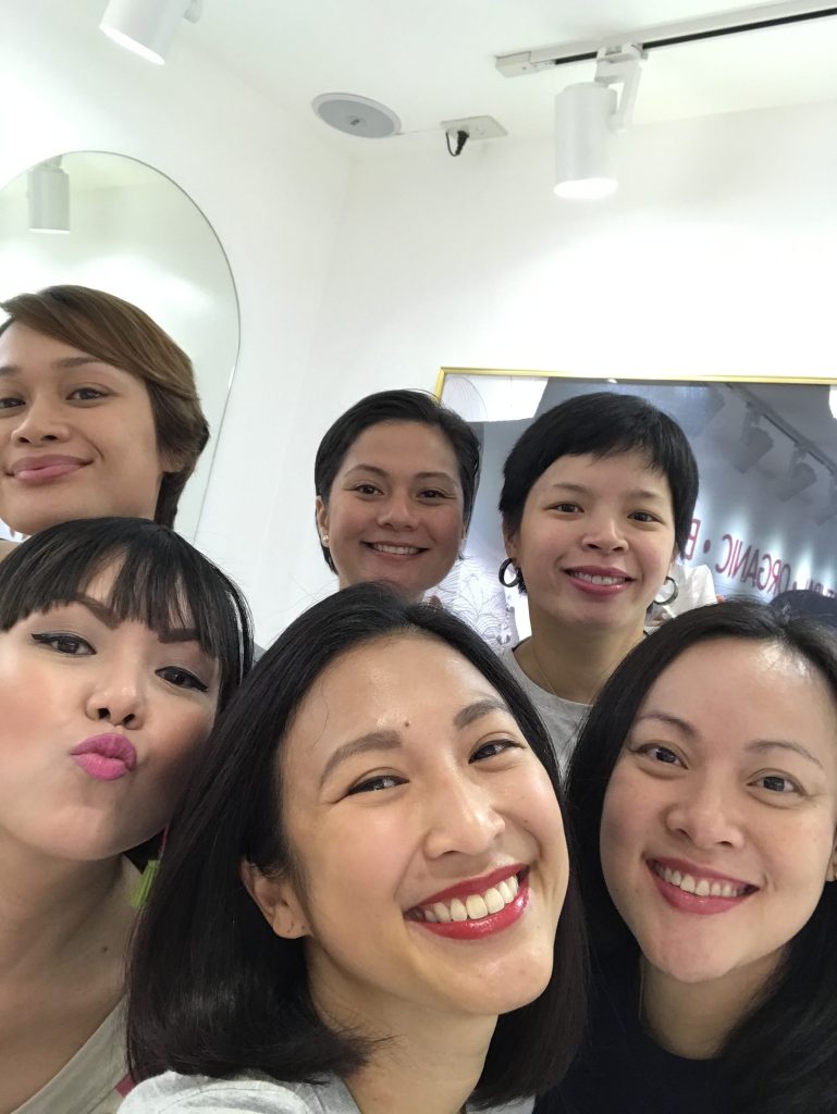 Smiling girls with lipstick on